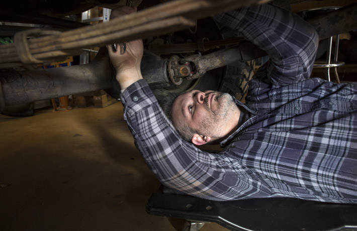 Man Working Under Vehicle